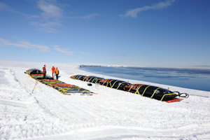Poly sleds with fuel bladders being filled on Abbot Ice Shelf. Photo: Simon Garrod.
