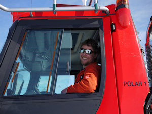 A smiling PistenBully driver during the deployment of the iSTAR tractor train.