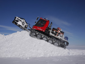One of the Polar tractors shovelling snow. Photo: Paul Torode.