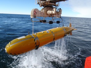 Autosub-3 being winched back on board after a mission beneath Pine Island Glacier in 2009. Photo: Pierre Dutrieux, British Antarctic Survey.